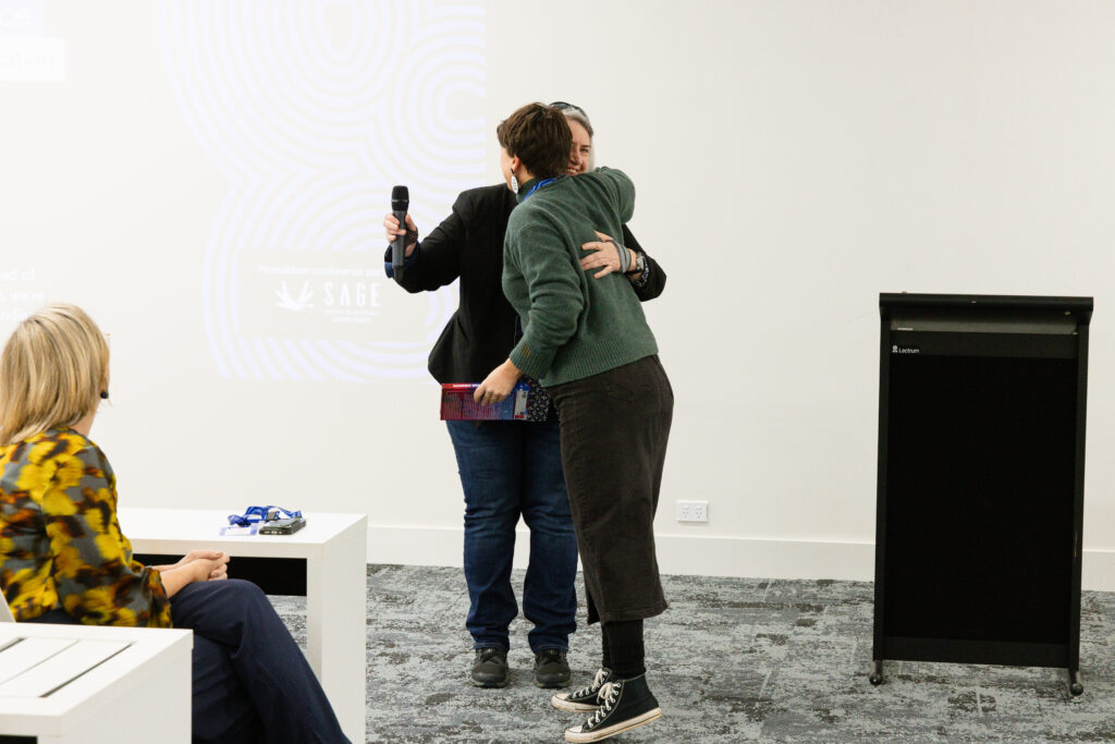 Two people hugging