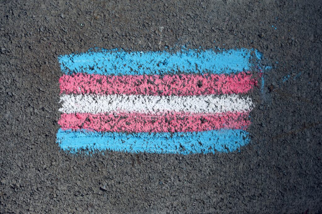 transgender pride flag in chalk on pavement
