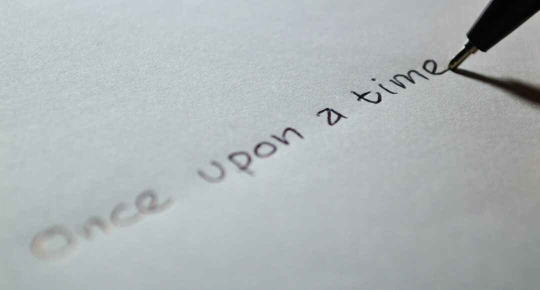 handwritten 'once upon a time' on paper with pen